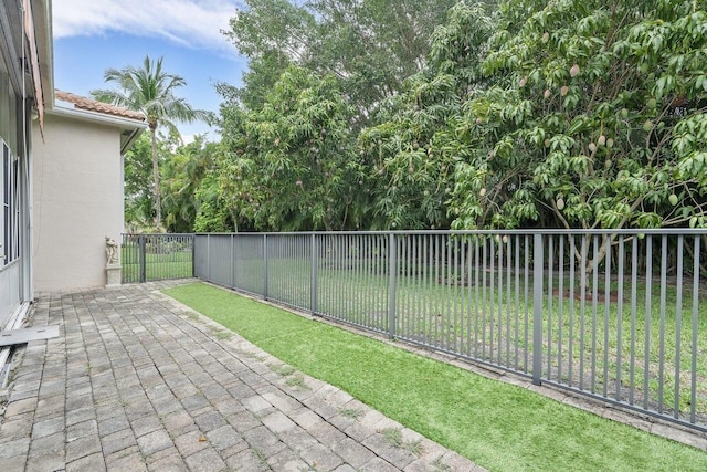 8351 Mastic Cay, West Palm Beach, FL 33411 - view of yard featuring a patio area