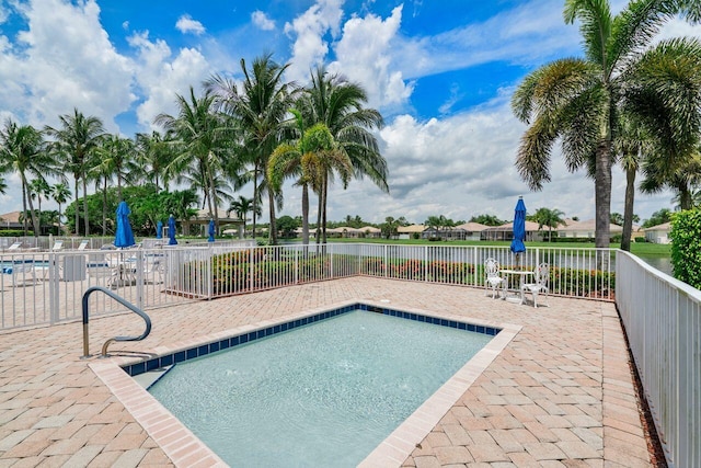 8351 Mastic Cay, West Palm Beach, FL 33411 - community pool with a patio area