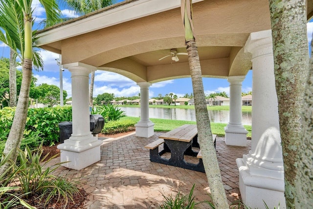 8351 Mastic Cay, West Palm Beach, FL 33411 - view of patio / terrace with ceiling fan and a water view