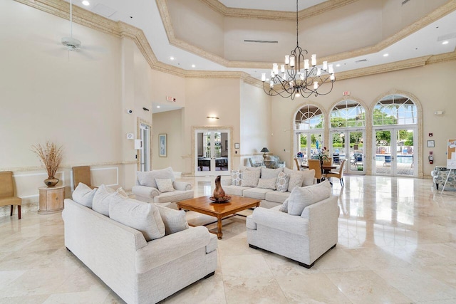 8351 Mastic Cay, West Palm Beach, FL 33411 - living room with a towering ceiling, a chandelier, crown molding, recessed lighting, and light marble finish flooring