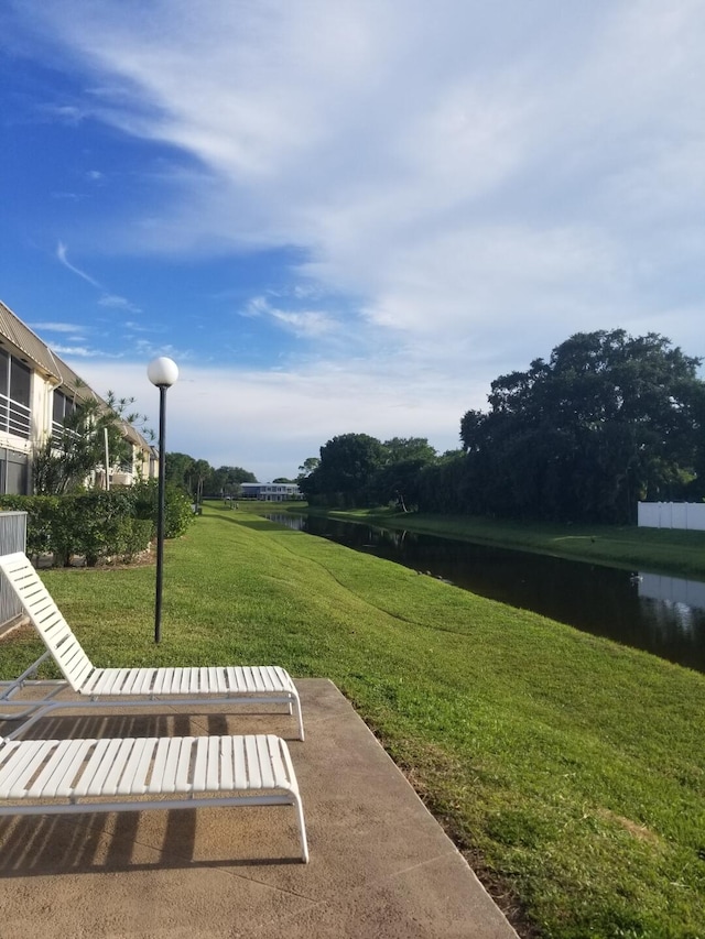 10789 N Military Trl Unit 3, Palm Beach Gardens, FL 33410 - view of green lawn featuring a water view