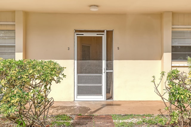 10789 N Military Trl Unit 3, Palm Beach Gardens, FL 33410 - property entrance with stucco siding