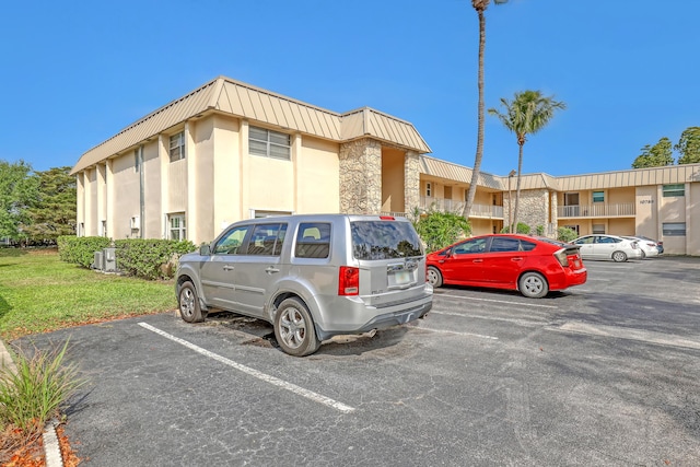 10789 N Military Trl Unit 3, Palm Beach Gardens, FL 33410 - view of building exterior featuring uncovered parking