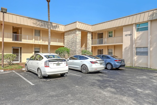 10789 N Military Trl Unit 3, Palm Beach Gardens, FL 33410 - view of property featuring uncovered parking