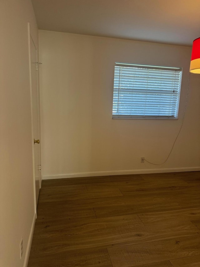 10789 N Military Trl Unit 3, Palm Beach Gardens, FL 33410 - empty room featuring dark wood-style floors and baseboards