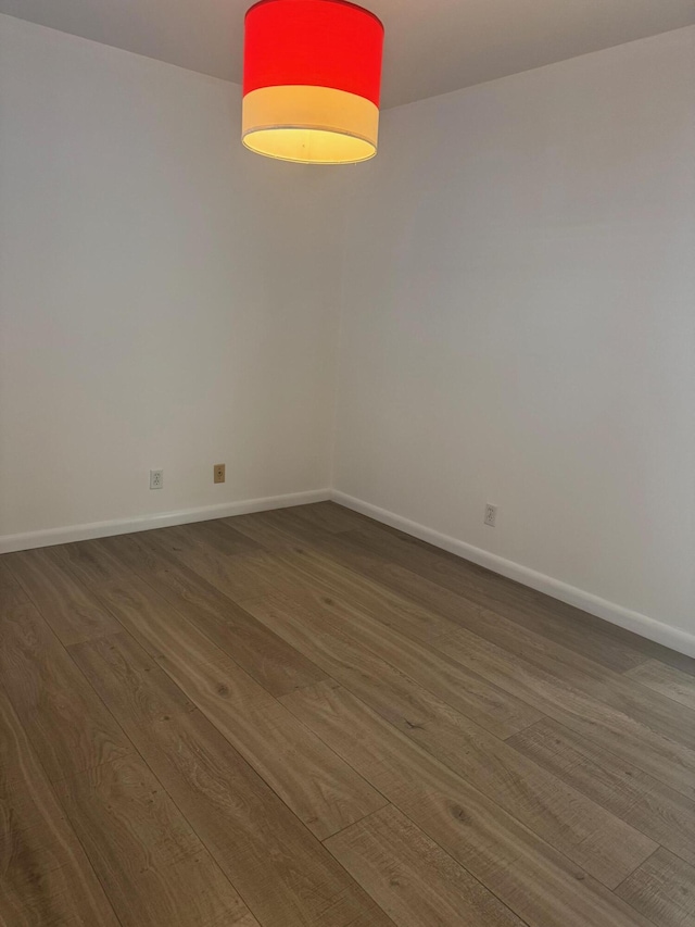 10789 N Military Trl Unit 3, Palm Beach Gardens, FL 33410 - spare room with wood finished floors and baseboards