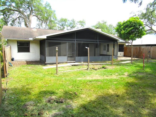 334 Brookedge Ter, Sebastian, FL 32958 - back of house featuring a sunroom, roof with shingles, and stucco siding