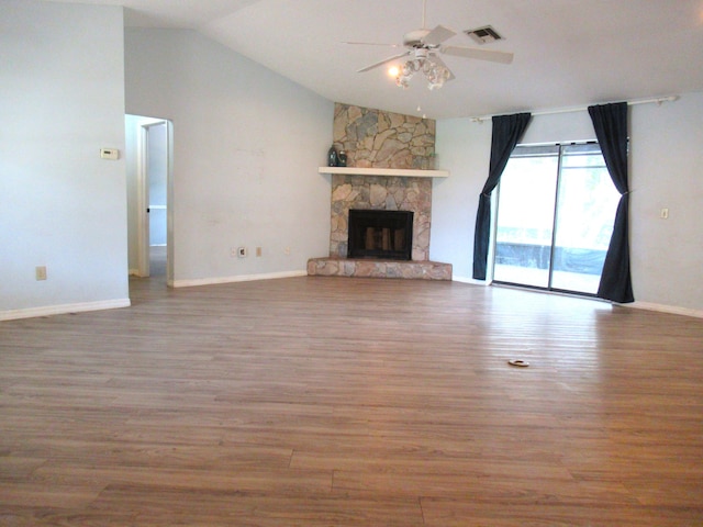 334 Brookedge Ter, Sebastian, FL 32958 - unfurnished living room featuring lofted ceiling, wood finished floors, a ceiling fan, a fireplace, and baseboards