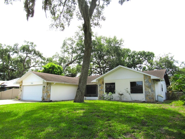 334 Brookedge Ter, Sebastian, FL 32958 - single story home with stone siding, an attached garage, and concrete driveway