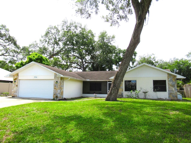 334 Brookedge Ter, Sebastian, FL 32958 - ranch-style home featuring stone siding, an attached garage, and concrete driveway