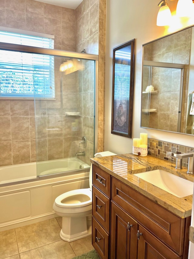 4920 Swans Ln, Coconut Creek, FL 33073 - bathroom with vanity, toilet, tile patterned flooring, and enclosed tub / shower combo