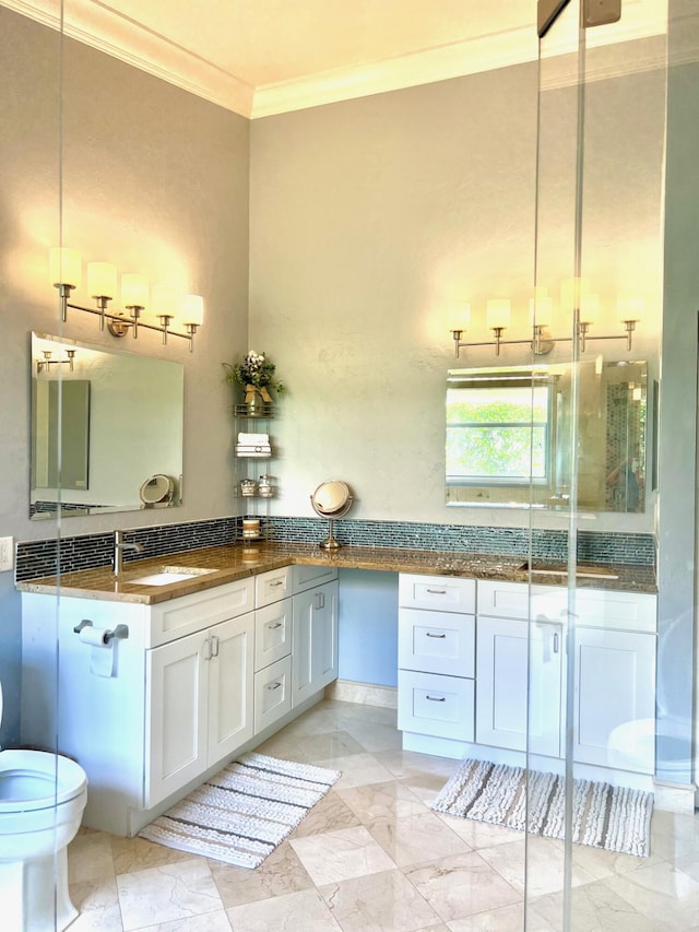 4920 Swans Ln, Coconut Creek, FL 33073 - bathroom featuring crown molding, vanity, toilet, and marble finish floors