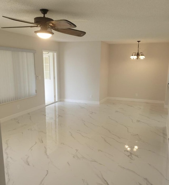 4988 Sable Pine Cir Unit B2, West Palm Beach, FL 33417 - empty room with marble look tile flooring, ceiling fan, baseboards, and a textured ceiling
