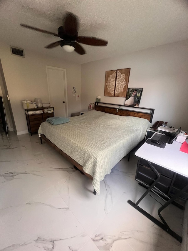 4988 Sable Pine Cir Unit B2, West Palm Beach, FL 33417 - bedroom featuring light marble finish floors, ceiling fan, and a textured ceiling