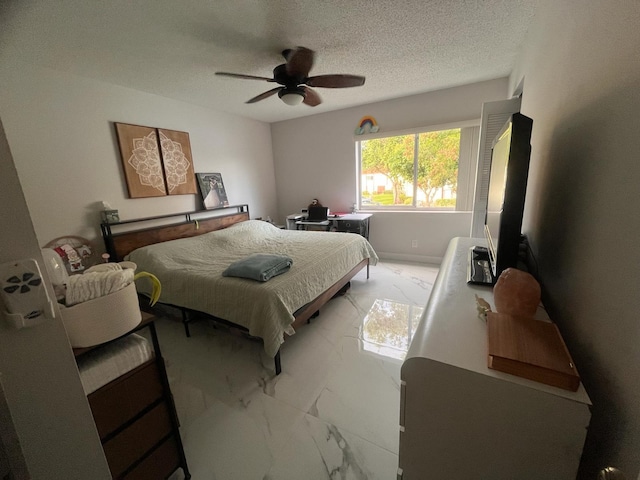 4988 Sable Pine Cir Unit B2, West Palm Beach, FL 33417 - bedroom with light marble finish floors, a textured ceiling, and a ceiling fan