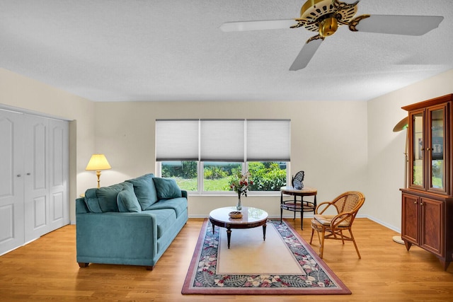 5229 Lakefront Blvd Unit A, Delray Beach, FL 33484 - living room with ceiling fan, light wood finished floors, and a textured ceiling