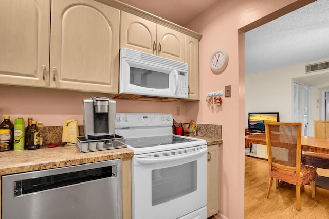 5229 Lakefront Blvd Unit A, Delray Beach, FL 33484 - kitchen with white appliances, light wood-type flooring, and light countertops