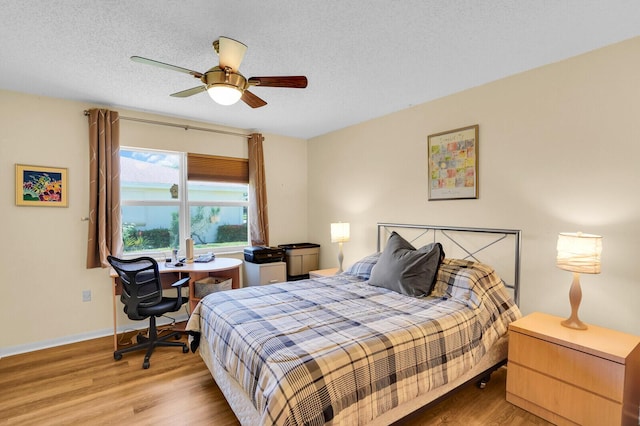 5229 Lakefront Blvd Unit A, Delray Beach, FL 33484 - bedroom with wood finished floors, ceiling fan, a desk, and a textured ceiling