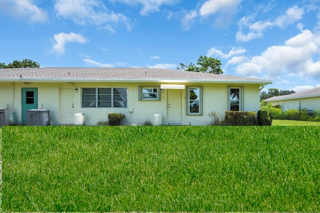 5229 Lakefront Blvd Unit A, Delray Beach, FL 33484 - back of house with stucco siding and a lawn