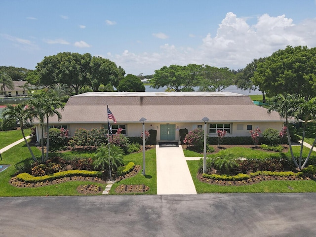 5229 Lakefront Blvd Unit A, Delray Beach, FL 33484 - view of front facade featuring a front lawn