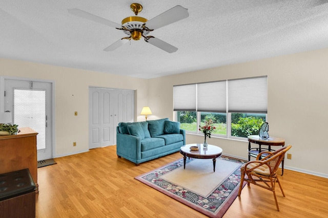 5229 Lakefront Blvd Unit A, Delray Beach, FL 33484 - living room featuring wood finished floors, ceiling fan, and a textured ceiling
