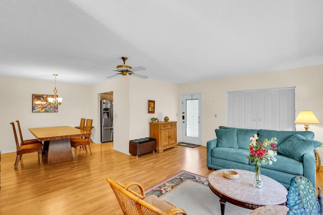 5229 Lakefront Blvd Unit A, Delray Beach, FL 33484 - living room featuring light wood-style floors, a chandelier, and ceiling fan