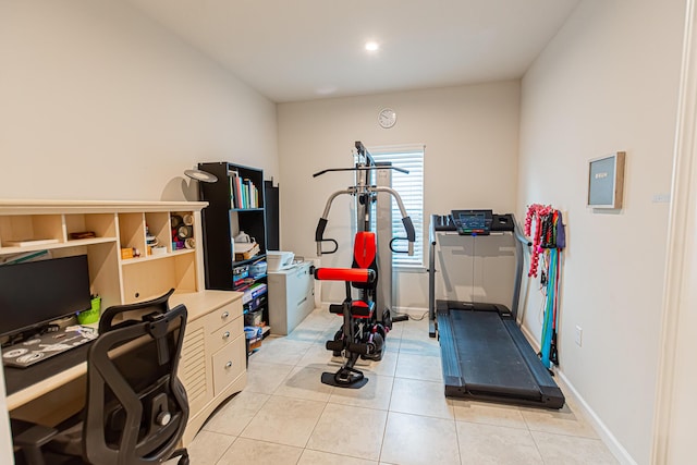 9351 SW Serapis Way, Port Saint Lucie, FL 34987 - workout room featuring light tile patterned flooring and baseboards