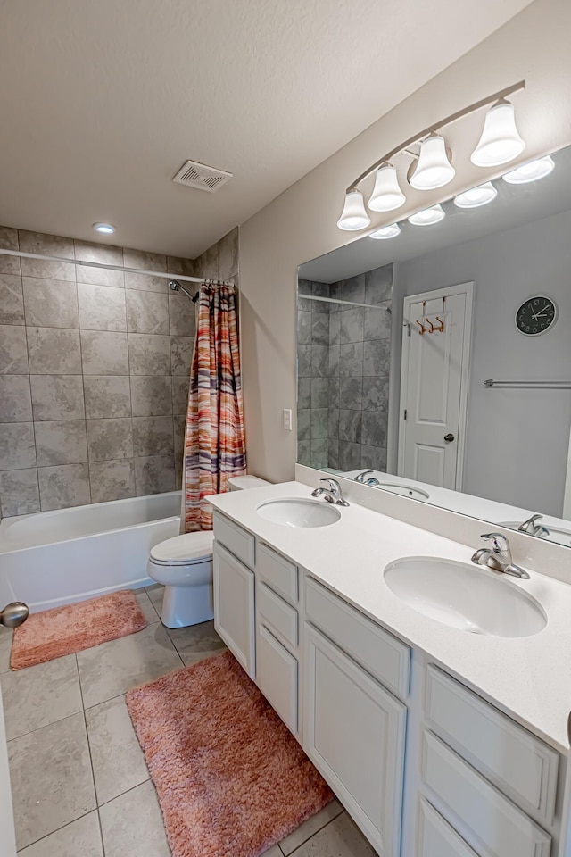 9351 SW Serapis Way, Port Saint Lucie, FL 34987 - bathroom with double vanity, toilet, shower / bath combo, and tile patterned flooring