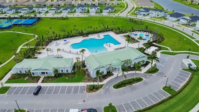 9351 SW Serapis Way, Port Saint Lucie, FL 34987 - drone / aerial view of a pool and a large body of water