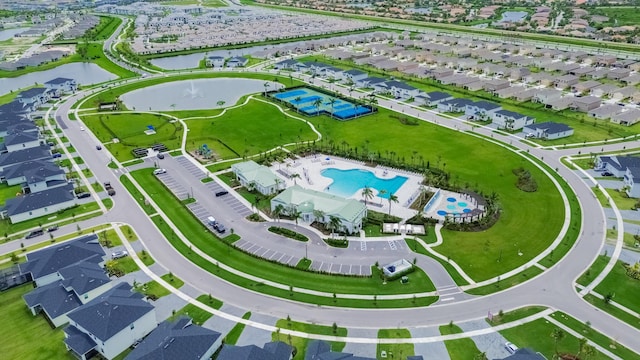 9351 SW Serapis Way, Port Saint Lucie, FL 34987 - aerial perspective of suburban area with a large body of water and a pool area