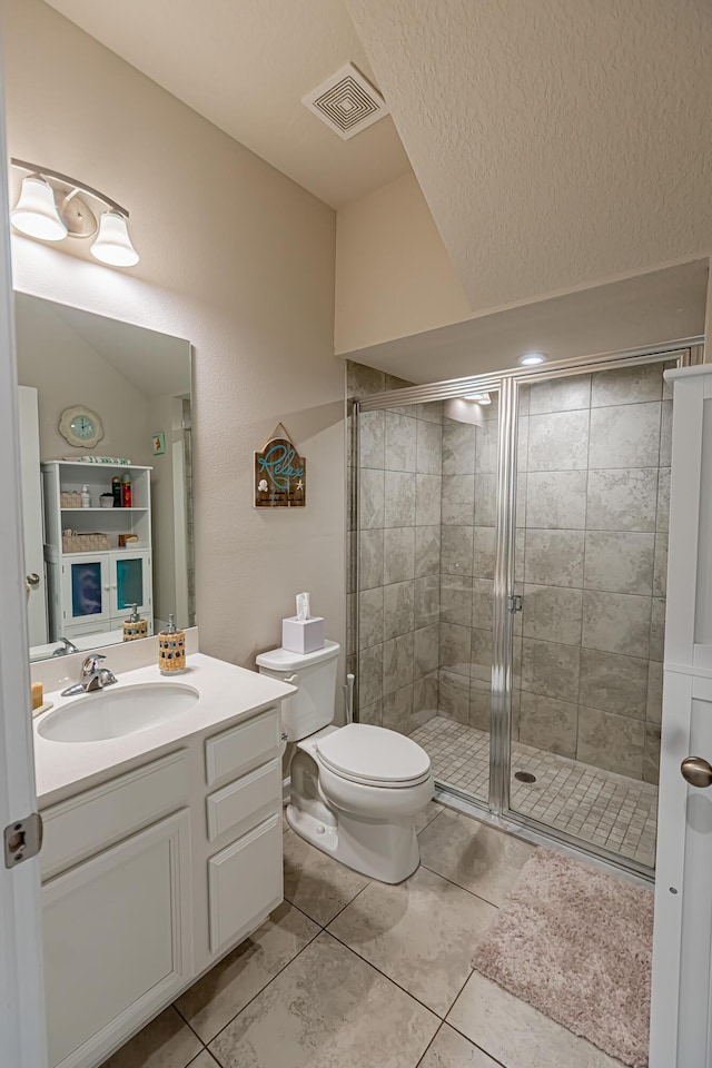 9351 SW Serapis Way, Port Saint Lucie, FL 34987 - full bathroom with vanity, a stall shower, tile patterned floors, and toilet