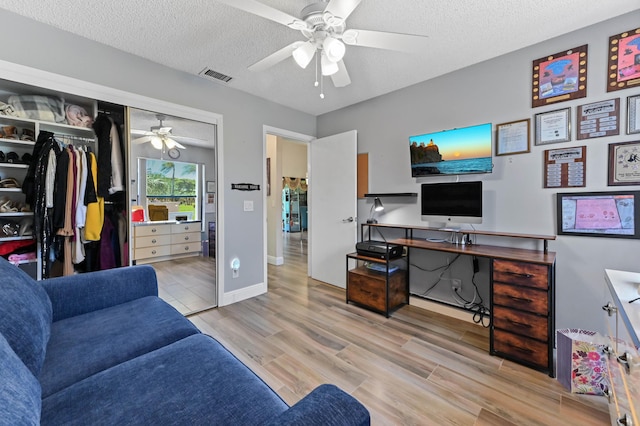 8178 Mooring Cir, Boynton Beach, FL 33472 - home office with ceiling fan, wood finished floors, a textured ceiling, and baseboards