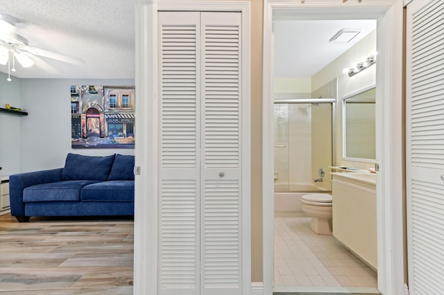 8178 Mooring Cir, Boynton Beach, FL 33472 - hall featuring a textured ceiling and tile patterned flooring