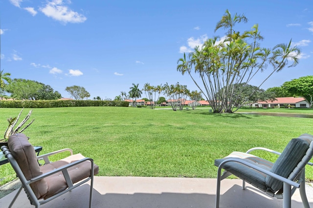 8178 Mooring Cir, Boynton Beach, FL 33472 - view of green lawn with a patio area