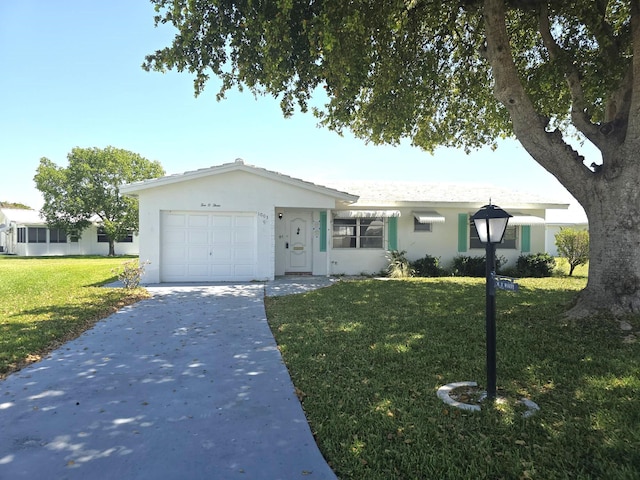 1003 SW 7th Ave, Boynton Beach, FL 33426 - ranch-style house with a garage, a front yard, stucco siding, and driveway