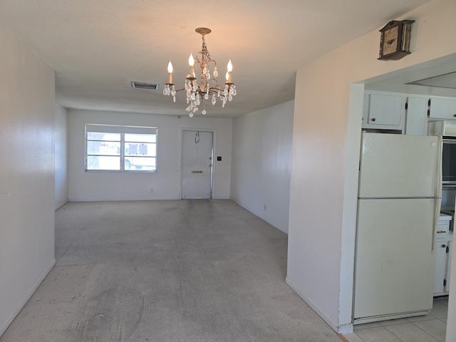 1003 SW 7th Ave, Boynton Beach, FL 33426 - unfurnished dining area featuring a chandelier, light colored carpet, and baseboards