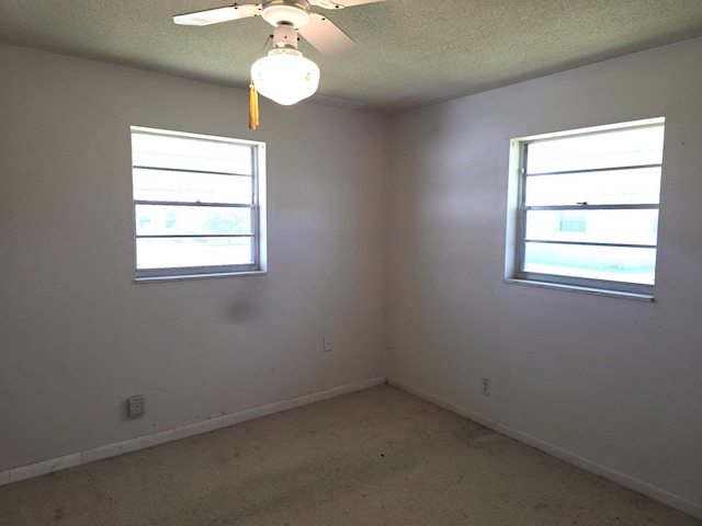 1003 SW 7th Ave, Boynton Beach, FL 33426 - unfurnished room featuring baseboards, a textured ceiling, light carpet, and ceiling fan