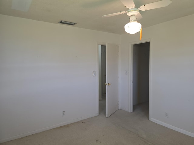 1003 SW 7th Ave, Boynton Beach, FL 33426 - unfurnished bedroom featuring baseboards, light carpet, and ceiling fan