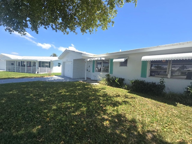 1003 SW 7th Ave, Boynton Beach, FL 33426 - view of front of home with an attached garage and stucco siding