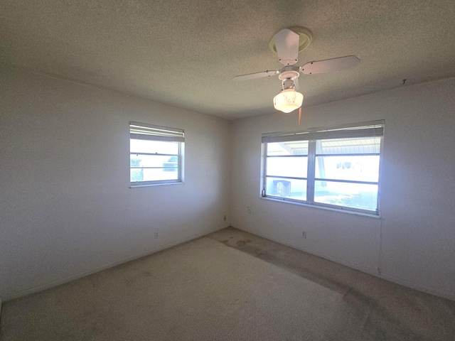 1003 SW 7th Ave, Boynton Beach, FL 33426 - carpeted empty room with a textured ceiling and ceiling fan