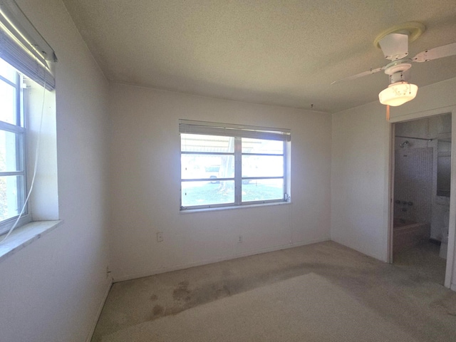 1003 SW 7th Ave, Boynton Beach, FL 33426 - spare room with carpet floors, a ceiling fan, and a textured ceiling
