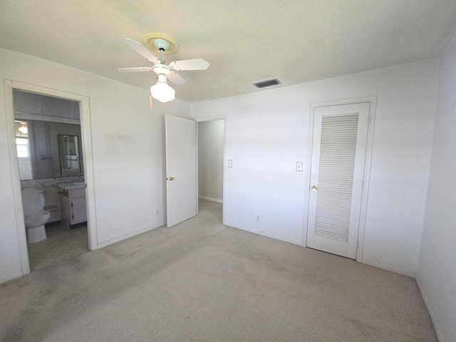 1003 SW 7th Ave, Boynton Beach, FL 33426 - unfurnished bedroom with carpet floors, ensuite bathroom, ceiling fan, and a closet