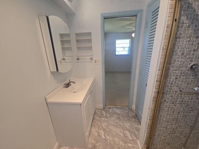 1003 SW 7th Ave, Boynton Beach, FL 33426 - bathroom with vanity, marble finish flooring, and baseboards