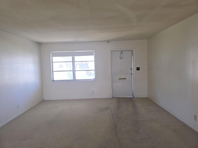 1003 SW 7th Ave, Boynton Beach, FL 33426 - spare room with light colored carpet and baseboards