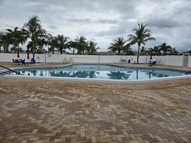 2941 Crrosley Dr W Unit E, West Palm Beach, FL 33415 - community pool with a patio area
