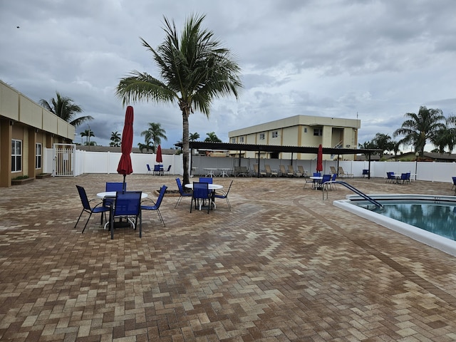 2941 Crrosley Dr W Unit E, West Palm Beach, FL 33415 - community pool featuring outdoor dining space and a patio