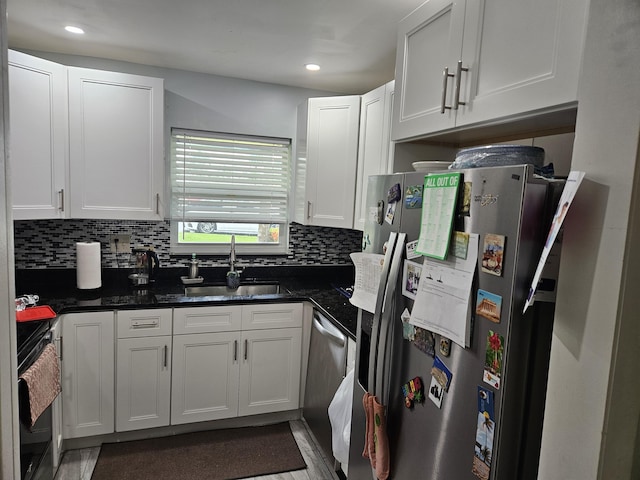 2941 Crrosley Dr W Unit E, West Palm Beach, FL 33415 - kitchen featuring a sink, stainless steel appliances, backsplash, white cabinets, and recessed lighting