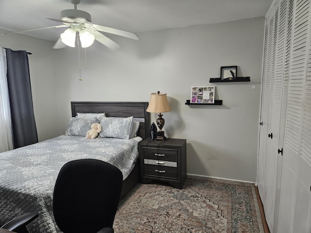 2941 Crrosley Dr W Unit E, West Palm Beach, FL 33415 - bedroom featuring a closet, baseboards, and ceiling fan