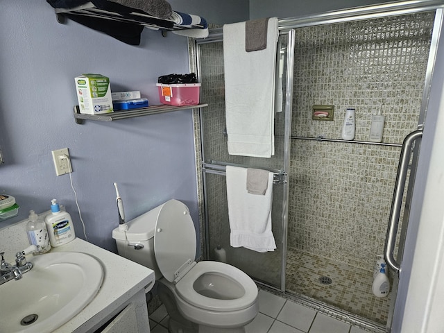 2941 Crrosley Dr W Unit E, West Palm Beach, FL 33415 - bathroom featuring a shower stall, vanity, toilet, and tile patterned flooring