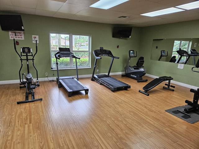 2941 Crrosley Dr W Unit E, West Palm Beach, FL 33415 - workout area with wood finished floors, baseboards, and a paneled ceiling